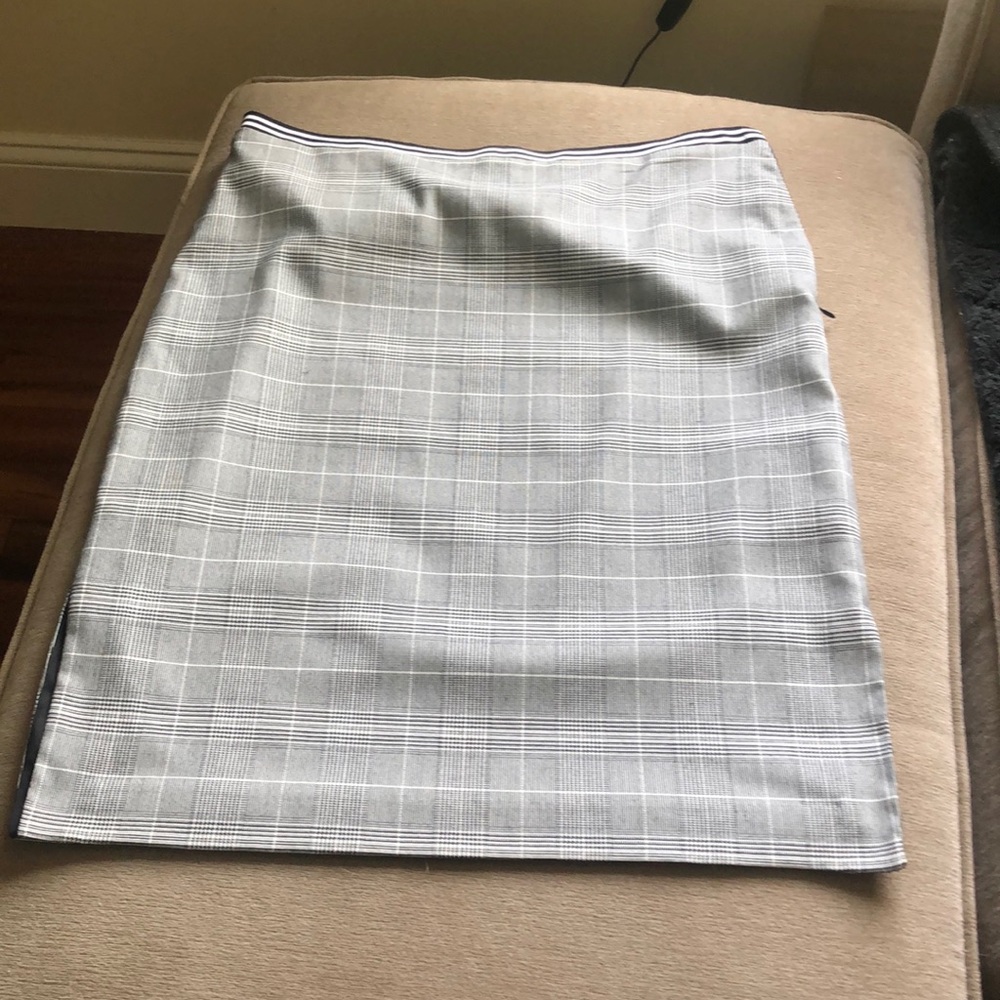 Houndstooth pencil skirt with slits on both sides. Gently used.